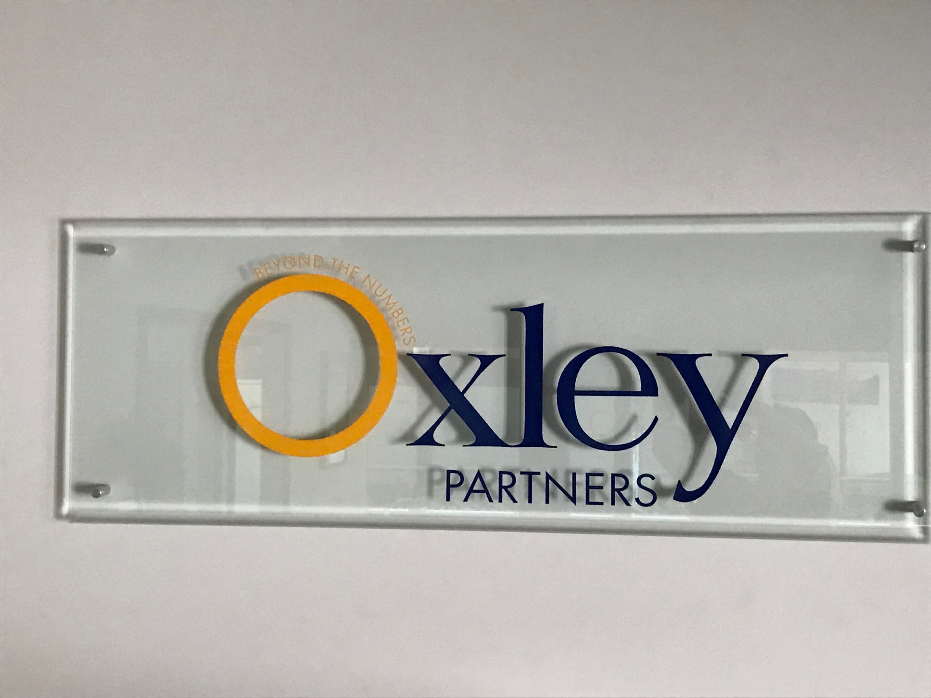 Oxley Partners frosted glass signage at the Bowral office